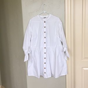short white dress with buttons and a tie sleeve
